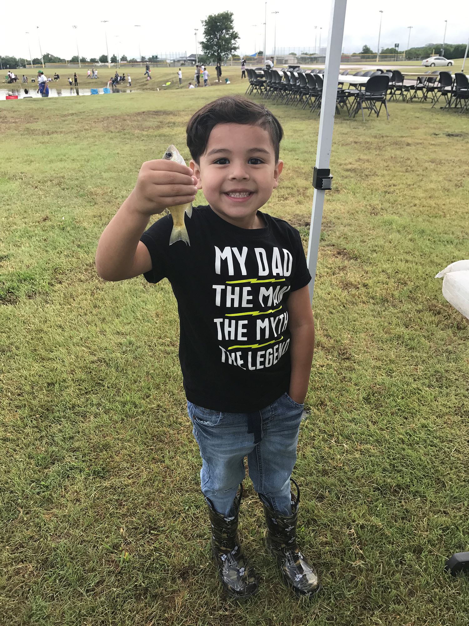 Boy Holding a Small Fish