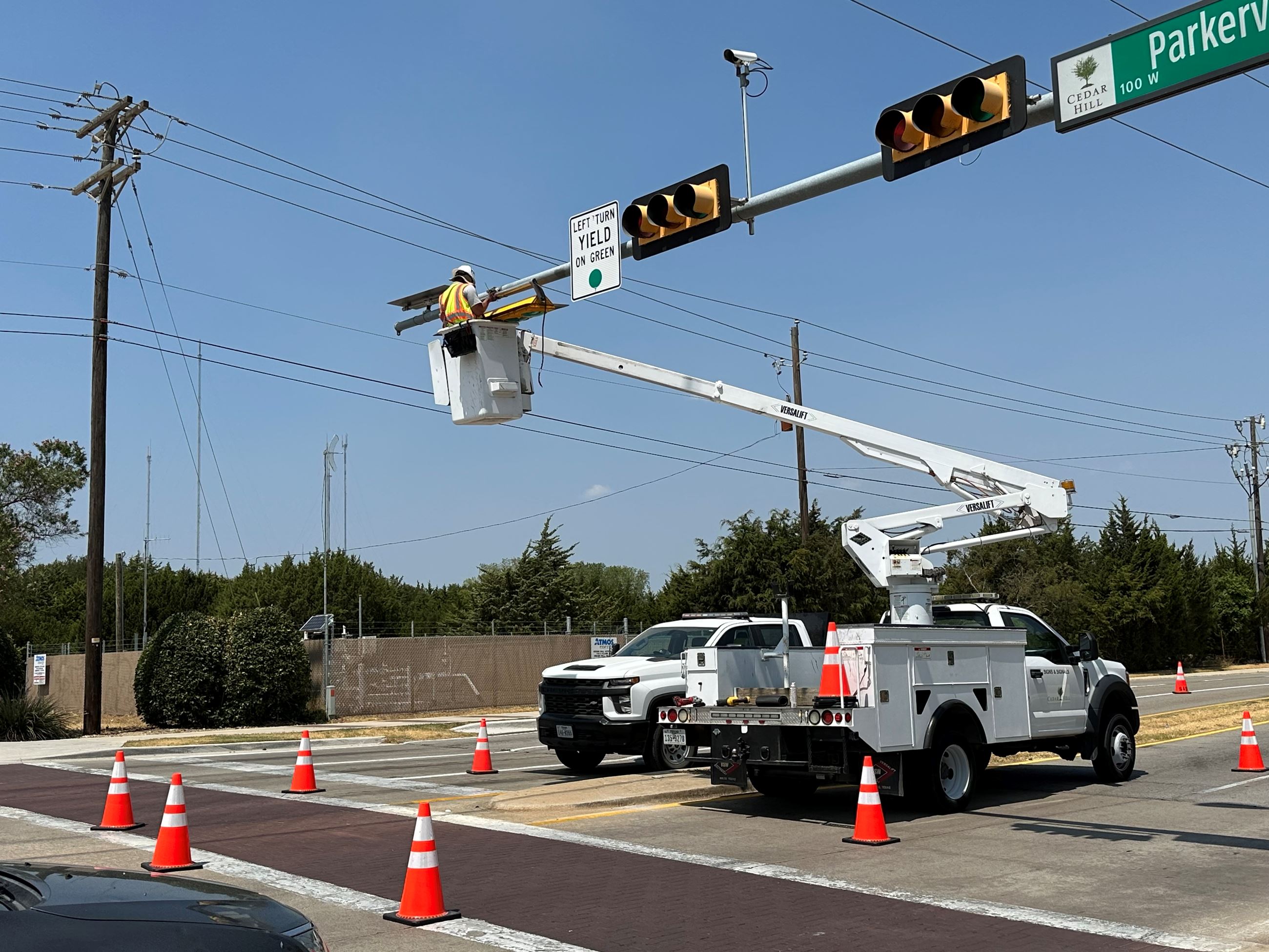 Signs and Signals crew repairing a signal light.